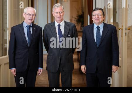Belgium's King Philippe, center, poses for photographers with European Commission President Jose Manuel Barroso, right, and European Council President Herman Van Rompuy at the Royal Castle of Laeken in Brussels on Monday Nov. 4, 2013. (AP Photo/Geert Vanden Wijngaert)
