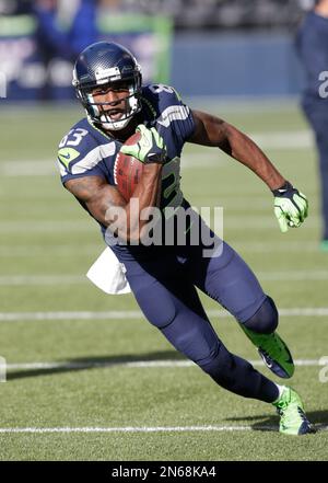 Seattle Seahawks wide receiver Ricardo Lockette (83) celebrates with  teammates, Doug Baldwin (89), Derrick Coleman (40) and Russell Wilson (3)  after catching a 39-yard touchdown pass from wilson against the Denver  Broncos