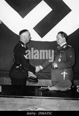 Hand Goring Nazi party members Heinrich Himmler and Hans Frank talking together ...