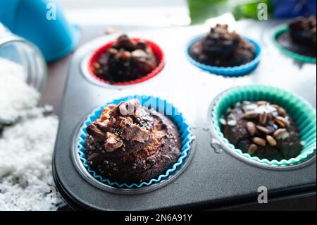 Freshly baked muffins , Cupcake molds . Homemade baking concept Stock Photo