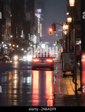 car stopped on a wet street Stock Photo