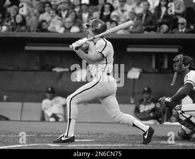 Philadelphia Phillies' Mike Schmidt watches the flight of his