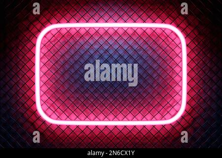 Glowing pink  neon lighting frame on metal mesh  background. Stock Photo