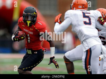 University of Maryland Terrapins receiver Stefon Diggs (1) tries to avoid  University of Iowa Hawkeyes defensive back John Lowdermilk (37) during game  played at Capital One Field at Byrd Stadium in College