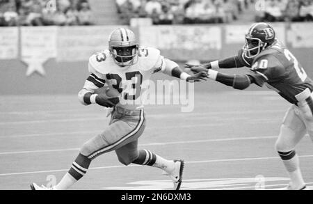 Dallas Cowboys Tony Dorsett (33) takes handoff from quarterback Roger  Staubach (12) game against the Pittsburgh Steelers shown in 1977. Dorsett,  the Heisman Trophy winner who sprinted his way into a select