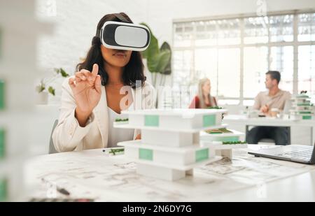 African american architect using ai headset.businesswoman playing a game on a VR headset. Designer using game gadget to watch architecture videos Stock Photo