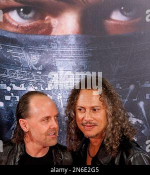 Metallica lead singer James Hetfield, left, salutes the crowd alongside  guitarist Kirk Hammett after playing he national anthem before a baseball  game between the San Francisco Giants and Los Angeles Angels on