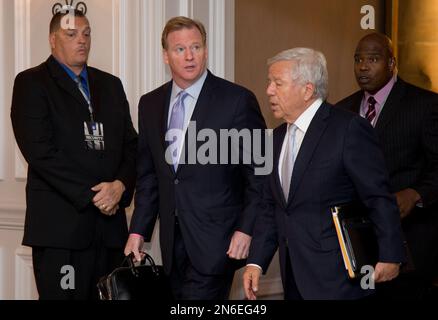 NFL Commissioner Roger Goodell, second from right, is joined by Terrell  Owens, right, New York Jets owner Woody Johnson, second from left, and  Johnson's wife Suzanne, center left, as he cuts the