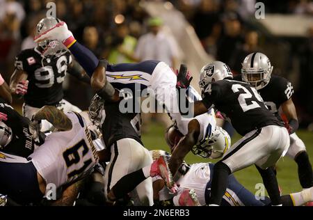 Ronnie Brown, center, a running back from Auburn, is joined by