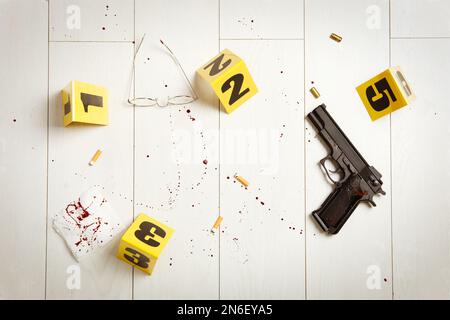 Flat lay composition with evidences on white wooden background. Crime scene Stock Photo