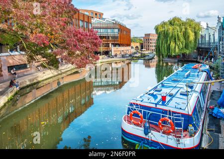 View to promenade along Regents Canal and tourist boat in Camden Town. London, England Stock Photo