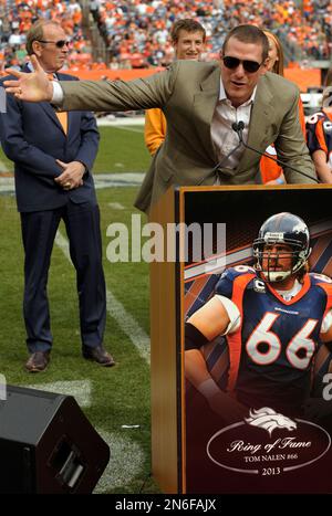 Former Denver Broncos center Tom Nalen talks to the crowd during a ceremony  where Nalen was inducted into the Denver Broncos Ring of Fame at an NFL  football game between the Denver