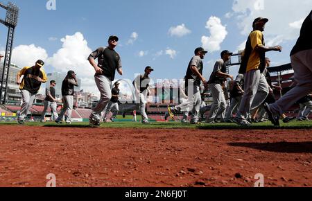 Pittsburgh Pirates players warm up during a workout at Busch Stadium,  Wednesday, Oct. 2, 2013, in St. Louis. Game 1 of the National League  Division Series baseball playoff between the Pirates and