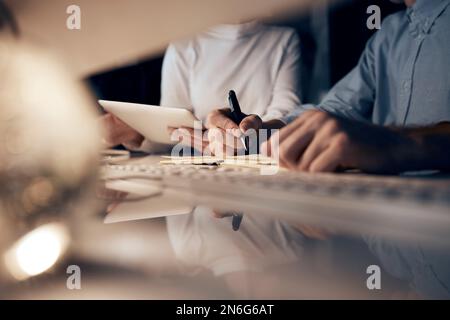 Tablet, night research or programmer team writing for cybersecurity, app coding or data analysis. Hands, developer or collaboration on tech for Stock Photo