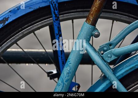 Light blue bicycle frame in the rain, raindrops on bicycle, frame of bicycle, Amsterdam, Netherlands Stock Photo
