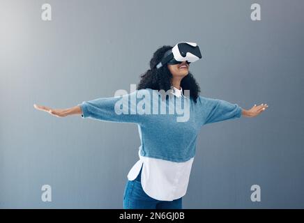 Woman, virtual reality glasses and metaverse with mockup space and hands for 3d flying game in studio. Gamer person vr headset for digital experience Stock Photo
