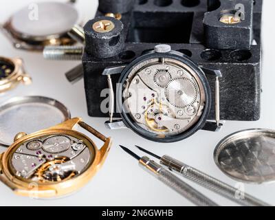 open used mechanical watch on heap of spare parts Stock Photo - Alamy