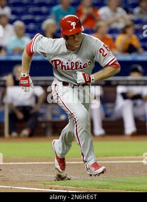 Philadelphia Phillies' Chase Utley heads to the plate past Florida