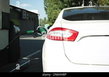 Refueling modern car with petrol pump on gas station, closeup Stock Photo