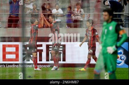 South Korea's FC Seoul striker Dejan Damjanovic, left, fights for the ball  against Al Ahli's Jose Marcio Da Costa, top right, and Osama Hawsawi during  their AFC Champions League quarterfinal second leg