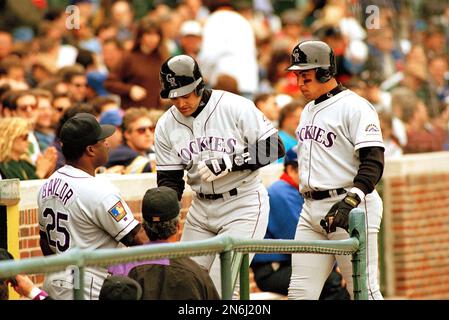 New York Mets' catcher Todd Hundley, left, chases a dropped third strike  against Colorado Rockies batter Andres Galarraga in the first inning in  Denver on Saturday, Aug., 16, 1997. Galarraga was put