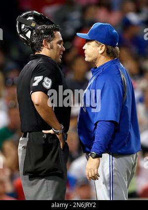 Los Angeles Dodgers' Jonny Deluca, center, is congratulated by Miguel  Rojas, right, after scoring on a balk as Houston Astros catcher Yainer Diaz  kneels at the plate during the eighth inning of