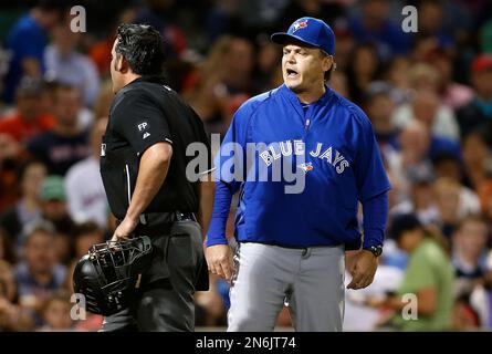 Los Angeles Dodgers' Jonny Deluca, center, is congratulated by Miguel  Rojas, right, after scoring on a balk as Houston Astros catcher Yainer Diaz  kneels at the plate during the eighth inning of