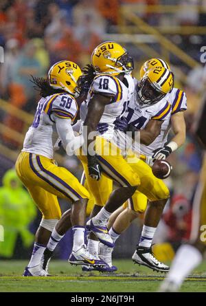 LSU linebacker Tahj Jones 58 linebacker Lamin Barrow 18 and