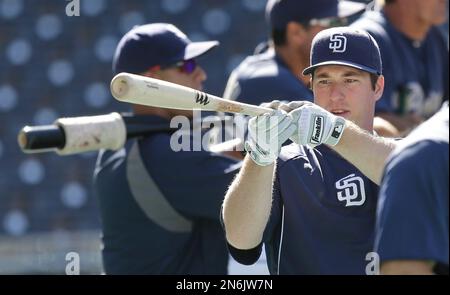 San Diego Padres' rookie Jedd Gyorko swings a weighted bat while getting  ready for batting practice during pre-game warmups for a baseball game  against the Colorado Rockies Friday April 12, 2013 in