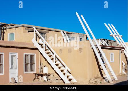 Traditional white ladders of Acoma Pueblo (Sky city), famous Native American pueblo in New Mexico, USA Stock Photo