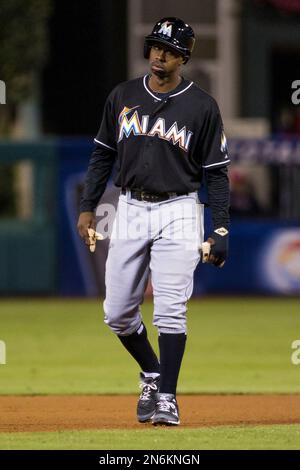 Miami Marlins Juan Pierre (9) takes a bunt against the New York Mets during  a spring training game at the Roger Dean Complex in Jupiter, Florida on  March 3, 2013. Miami defeated