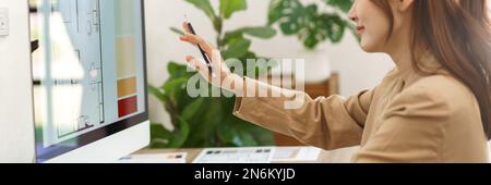 Architectural concept, Female architect working and thinking about designing house interior project. Stock Photo