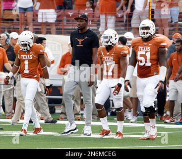 Texas basketball player Kevin Durant, left, walks with his mother, Wanda  Pratt, center and Texas coach