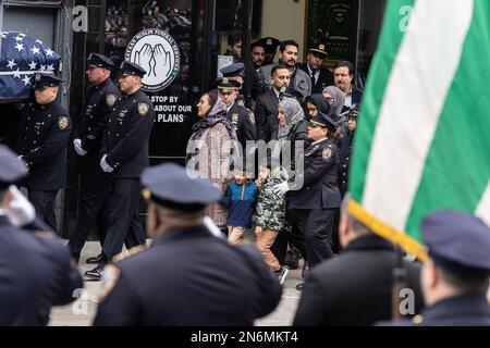 New York, USA. 09th Feb, 2023. PO Adeed Fayaz wife, two boys and mother seen at his funeral at the Makki Masjid Muslim Community Center in Brooklyn, New York on February 9, 2023. PO Fayaz was killed in a botched robbery while he tried to buy a car, he was off duty at the time. (Photo by Lev Radin/Sipa USA) Credit: Sipa USA/Alamy Live News Stock Photo