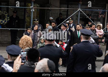 New York, USA. 09th Feb, 2023. PO Adeed Fayaz wife, two boys and mother seen at his funeral at the Makki Masjid Muslim Community Center in Brooklyn, New York on February 9, 2023. PO Fayaz was killed in a botched robbery while he tried to buy a car, he was off duty at the time. (Photo by Lev Radin/Sipa USA) Credit: Sipa USA/Alamy Live News Stock Photo