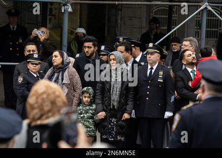 New York, USA. 09th Feb, 2023. PO Adeed Fayaz wife, two boys and mother seen at his funeral at the Makki Masjid Muslim Community Center in Brooklyn, New York on February 9, 2023. PO Fayaz was killed in a botched robbery while he tried to buy a car, he was off duty at the time. (Photo by Lev Radin/Sipa USA) Credit: Sipa USA/Alamy Live News Stock Photo