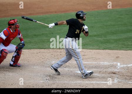 Texas Rangers catcher A.J. Pierzynski (12) follows through on a swing  against the Oakland Athletics in