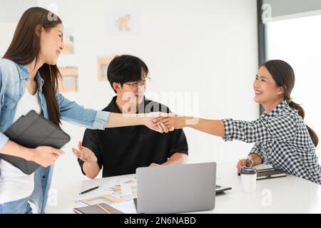 Construction design concept, Architects team shaking hand after introduce project and colleague. Stock Photo