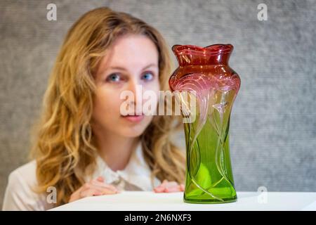 London, UK.  10 February 2023. A technician presents a rare Art Nouveau cut glass vase, circa 1900, Henri Van der Velde: made by Val Saint Lambert (Est. £2,000 - £3,000) at a photocall for the sale ‘Unity in Variety: The David Bonsall Collection of Decorative Arts and Design’ at Bonhams New Bond Street.  360 lots featuring 20th century decorative arts will be offered for sale on 14 February.  Credit: Stephen Chung / Alamy Live News Stock Photo