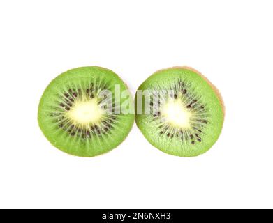 flat lay of organic kiwi fruit on green and pink Stock Photo by  LightFieldStudios