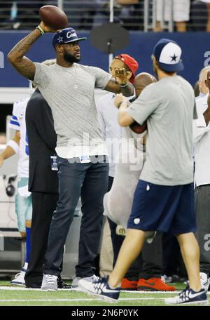 LeBron James tosses the football before the beginning of the game as the Dallas  Cowboys faced the Washington Redskins at FedEx Field in Landover, Maryland,  Sunday, September 12, 2010. (Photo by Ron