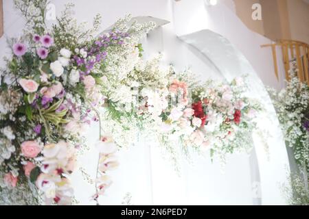 Beautiful Wedding Decoration Arrangement with Flowers, Leaves and Lamps Stock Photo