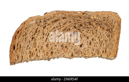 dried slice of brown wholegrain bread cutout on white background Stock Photo