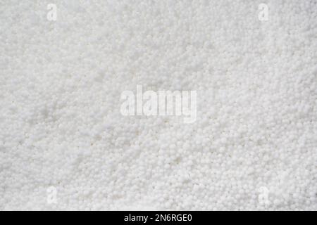Granular mineral fertilizer as background, closeup view Stock Photo