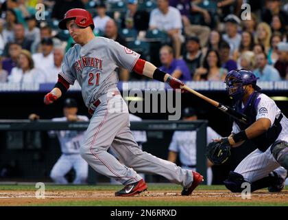 Cincinnati Reds' Todd Frazier, left, is congratulated by teammate Brandon  Phillips after hitting a solo home run during the sixth inning of a baseball  game against the St. Louis Cardinals, Friday, Sept.