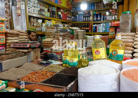 Dhaka, Bangladesh - February 10, 2023: Bangladeshi grocery vendors wait for customer at Karwan Bazar kitchen market in Dhaka, Bangladesh. Stock Photo