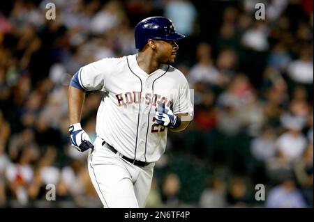 Houston Astros' Chris Carter rounds first after a solo home run