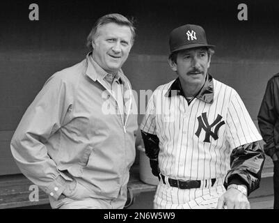 Reggie Jackson, manager Billy Martin and Graig Nettles of the New York  Yankees are all smiles on the way to the dugout after beating the Chicago  White Sox 7-6 in 11 innings