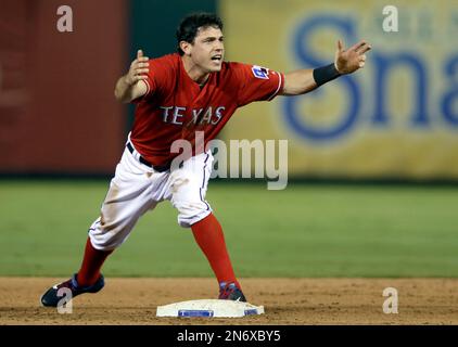 Texas Rangers Ian Kinsler reacts to a called third strike during the third  inning of the first baseball game of a doubleheader against the Baltimore  Orioles, Saturday, April 9, 2011, in Baltimore.