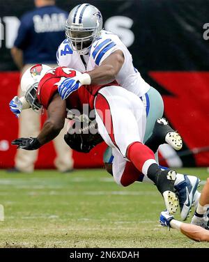 Photo: Dallas Cowboys Gerald Sensabaugh tackles New York Giants Bear Pascoe  at MetLife Stadium in New Jersey - NYP20120101112 